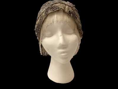 Lot 2186 - Original 1920s Flapper silver lace and beadwork cap.