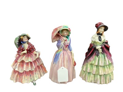 Lot 1190 - Three Royal Doulton figures - A Victorian Lady HN1208, Miss Demure HN1402 and The Hinged Parasol HN1579