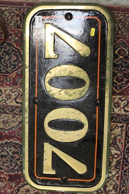 Lot 2536 - Heavy brass relief '7007' train sign, 64cm x 30cm