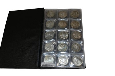 Lot 569 - South Africa - A folder containing mixed silver one Rand coins (90 coins)