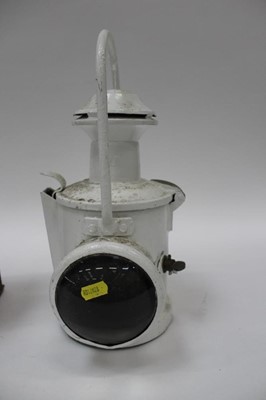 Lot 2548 - Two white painted railway lamps, the largest 46cm high
