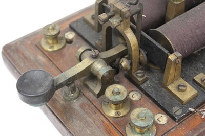 Lot 2551 - Antique telegraph machine, the wooden base measuring 23cm x 25cm