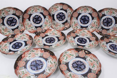 Lot 27 - Set of six late 19th century Japanese imari pattern plates with six character marks to underside, together with eleven other Japanese imari dishes (17)