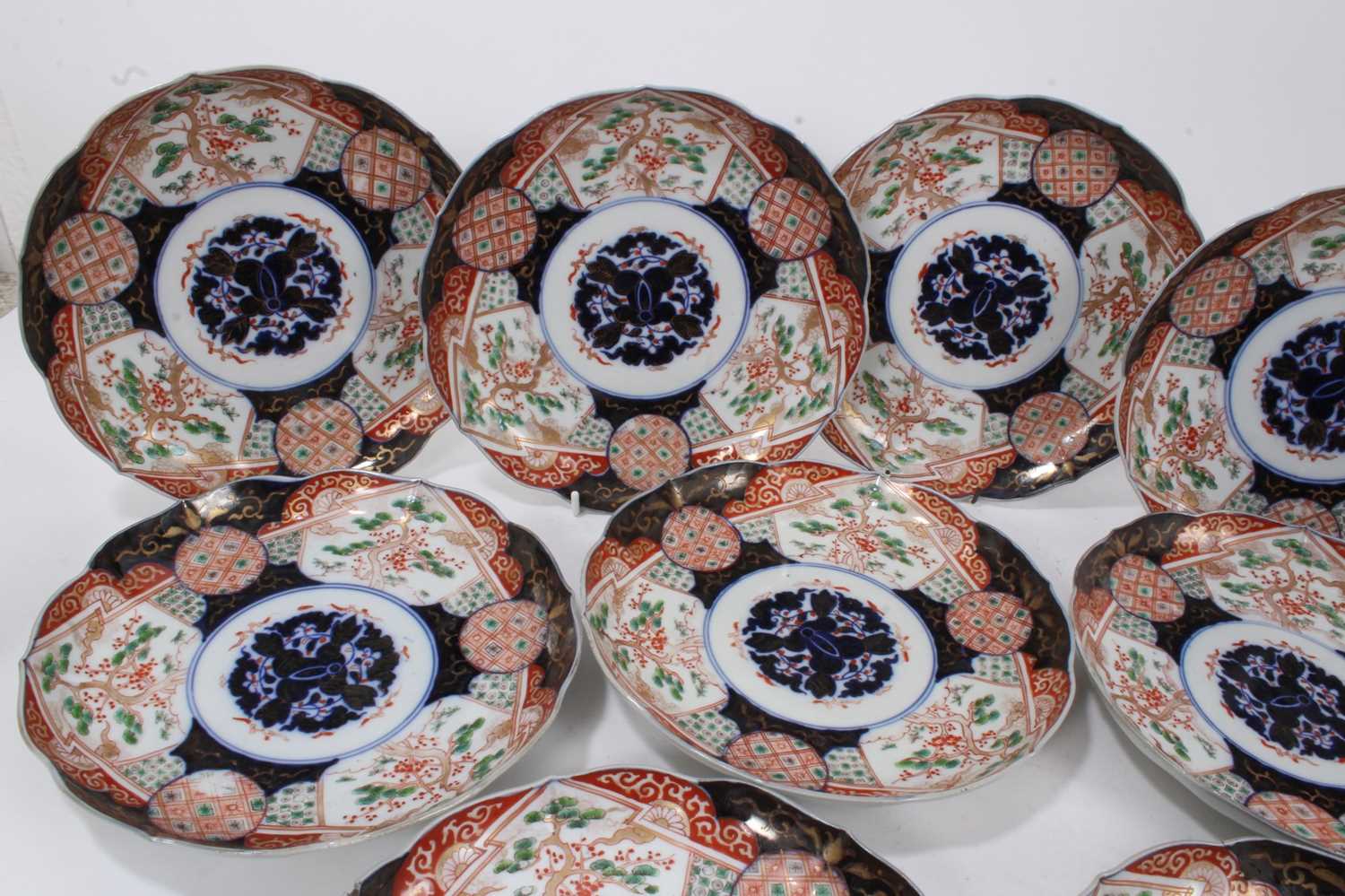 Lot 27 - Set of six late 19th century Japanese imari pattern plates with six character marks to underside, together with eleven other Japanese imari dishes (17)