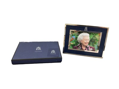 Lot 126 - H.M.Queen Elizabeth II, 2006 Royal Household Christmas present silver plated and blue leather photograph frame with embossed crowned ER II cipher and containg a charming photograph of Her late Maje...