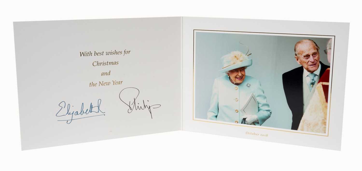 Lot 147 - H.M.Queen Elizabeth II and H.R.H. The Duke of Edinburgh, signed 2018 Christmas card with twin gilt ciphers to cover, colour photograph of the Royal couple to the interior with envelope