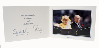 Lot 150 - H.M.Queen Elizabeth II and H.R.H. The Duke of Edinburgh, signed 2015 Christmas card with twin gilt ciphers to cover, colour photograph of the Royal couple riding in an open carriage at Royal Ascot...