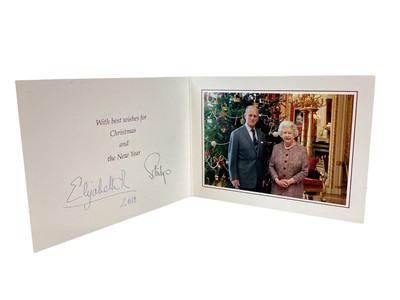 Lot 155 - H.M.Queen Elizabeth II and H.R.H. The Duke of Edinburgh, signed 2010 Christmas card with twin gilt ciphers to cover, colour photograph of the Royal couple beside a Christmas tree to the interior wi...