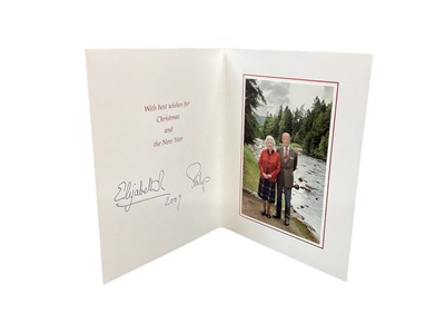 Lot 156 - H.M.Queen Elizabeth II and H.R.H. The Duke of Edinburgh, signed 2009 Christmas card with twin gilt ciphers to cover, colour photograph of the Royal couple in Scotland to the interior with envelope
