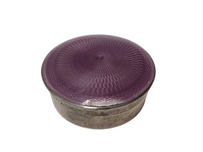Lot 209 - Mappin & Webb silver and purple enamel round pill box and a continental embossed silver oval box (2)