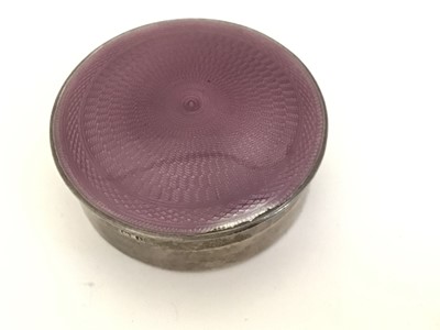 Lot 209 - Mappin & Webb silver and purple enamel round pill box and a continental embossed silver oval box (2)