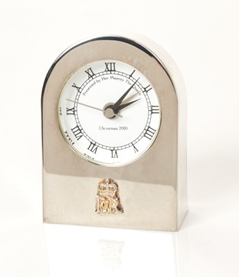 Lot 173 - H.M.Queen Elizabeth II, 2005 Royal Household Christmas present, silver plated alarm clock in domed case with crowned ERII cipher to front and ' Presented by Her Majesty The Quuen Christmas 2005' to...