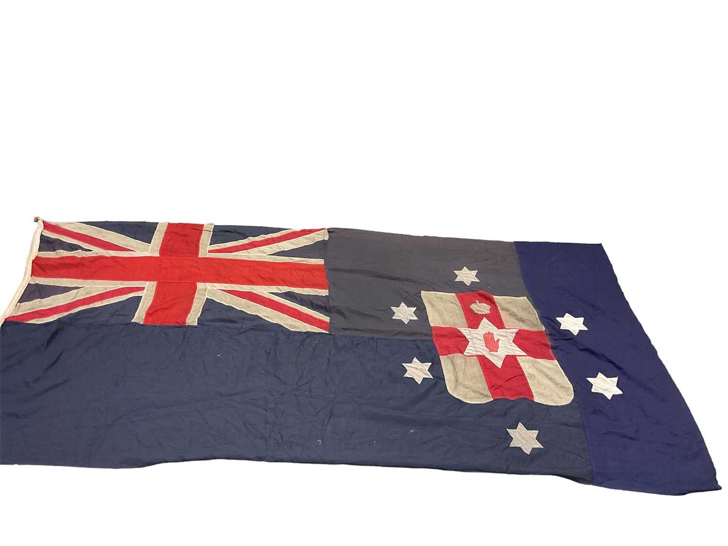 Lot 184 - Rare early 20th century early Northern Ireland Blue Ensign flag with crowned hand of Ulster on red and white shield surrounded by six stars Provenance: The vendors Grandfather was the Commanding Of...