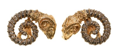 Lot 611 - Pair of Greek 18ct gold and silver earrings with gold rams head terminals on a coiled silver and gold rope twist body with gold clip fittings, signed Zolotas.