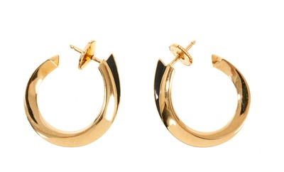 Lot 613 - Pair of Cartier 18ct gold hoop earrings, with polished gold square tubular section, signed Cartier.