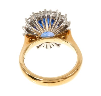 Lot 615 - Good quality tanzanite and diamond cluster ring with an oval mixed cut tanzanite weighing approximately 4.97cts surrounded by a border of 14 round brilliant cut diamonds estimated to weigh approxim...