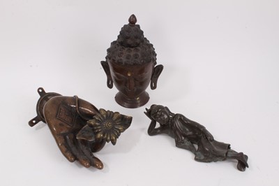 Lot 985 - Tibetan bronze reclining deity figure, together with two further bronzes