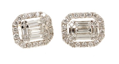 Lot 631 - Pair of diamond cluster earrings, the octagonal cluster with baguette cut and brilliant cut diamonds in 18ct white gold setting. Estimated total diamond weight approximately 1ct.