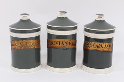 Lot 327 - Three 19th century pearlware drug jars and covers with gilt lettering, including 'Blackroot', 'Peruvian Bark' and 'Gentlan.R.P.', 22cm high