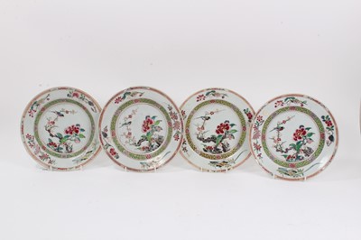 Lot 328 - Set of four 18th century Chinese export famille rose dishes, Yongzheng/Qianlong, decorated with birds, flowers and auspicious symbols, 22.5cm diameter