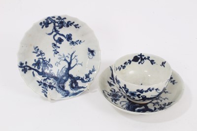 Lot 331 - A Worcester blue and white 'Prunus Root' pattern tea bowl and saucer, together with another faceted 'Prunus Root' saucer, all with crescent marks (3)