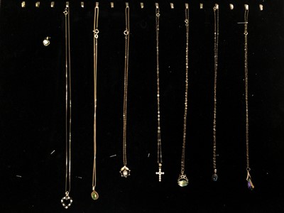 Lot 64 - Eight 9ct gold gem set pendants, seven on 9ct gold chains