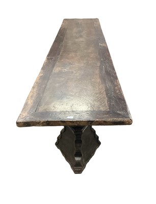 Lot 1523 - Substantial Italian walnut refectory table, the cleated plank top on pyramidal column supports