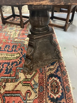 Lot 1523 - Substantial Italian walnut refectory table, the cleated plank top on pyramidal column supports