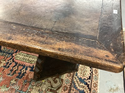 Lot 1523 - Substantial Italian walnut refectory table, the cleated plank top on pyramidal column supports