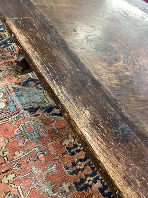 Lot 1523 - Substantial Italian walnut refectory table, the cleated plank top on pyramidal column supports