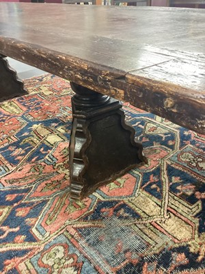 Lot 1523 - Substantial Italian walnut refectory table, the cleated plank top on pyramidal column supports