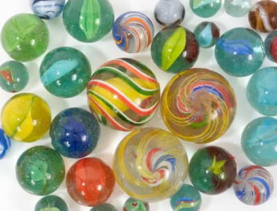 Lot 1011 - Three very large antique multi-ply spiral twist glass marbles, other marbles