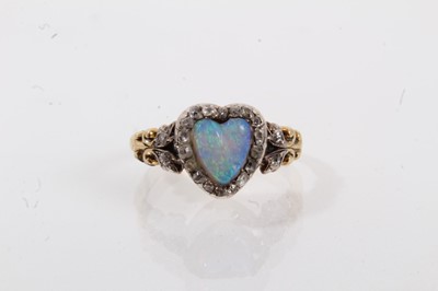 Lot 666 - Late Victorian opal and diamond heart shape ring with a heart-shape opal surrounded by a border of old cut and rose cut diamonds in silver setting with two further diamonds to the foliate scroll sh...