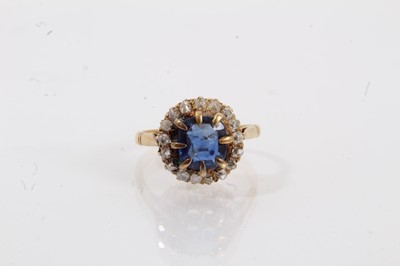 Lot 667 - Sapphire and diamond cluster ring with a cushion shape mixed cut blue sapphire measuring approximately 7.3 x 6.7 x 2.5mm, surrounded by a border of old cut diamonds in 18ct gold setting, ring size...