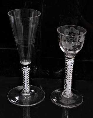 Lot 355 - Georgian wine glass, circa 1765, the ogee-shaped bowl with etched butterfly and flowers, over a double-series opaque twist stem and conical foot, 14.5cm high, together with a continental opaque twi...