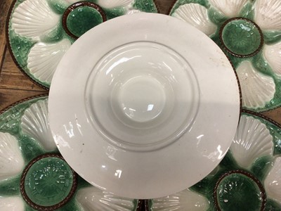 Lot 15 - Set of six French majolica oyster plates with basket weave moulding, painted green and brown, 24cm diameter