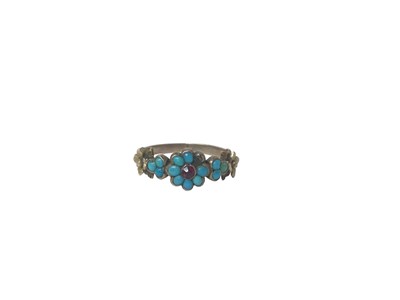 Lot 714 - Regency gold and turquoise forget-me-not ring with foliate gold shoulders, ring M½.