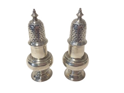 Lot 476 - Pair George V silver casters of baluster form with pierced slip in covers (London 1919