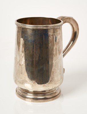 Lot 545 - 1920s silver mug of tapering baluster form, with loop handle, on a domed base