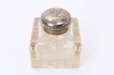 Lot 552 - Edwardian silver mounted cut glass inkwell, with hinged cover and engraved armorial crest (Birmingham 1907) marks rubbed. 7.5cm x 7.5cm