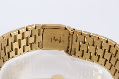 Lot 755 - Omega Constellation 18ct gold Automatic wristwatch with tonneau shape brushed gold dial with baton hour markers in tonneau shape case on integral 18ct gold articulated bracelet strap.
