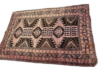 Lot 1302 - Baluch rug, with conjoined medallions on biscuit ground, 180 x 118cm