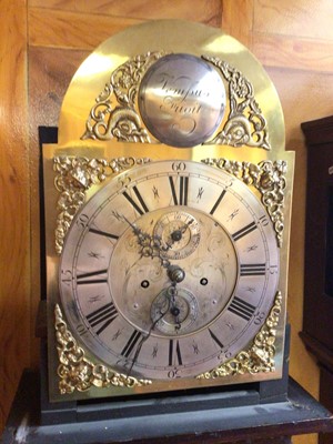 Lot 1089 - 18th century 8 day longcase clock, the arched brass dial with silvered chapter ring and subsidiary date and second dials, in an oak case with later carved decoration, 228cm.