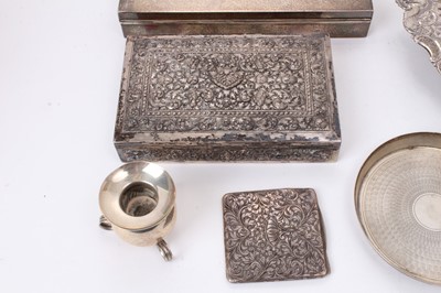 Lot 586 - Selection of Middle Eastern, Far Eastern and other silver and white metal, including four cigarette/cigar boxes, filligree dish, compact, mirror, candle holder and other items, some marked. (Qty)