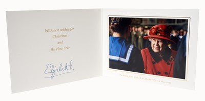 Lot 145 - H.M. Queen Elizabeth II, signed 2021Christmas card (the last official Christmas card sent by Her Late Majesty), with gilt cipher to cover and charming colour photograph of The Queen visiting H.M.S...