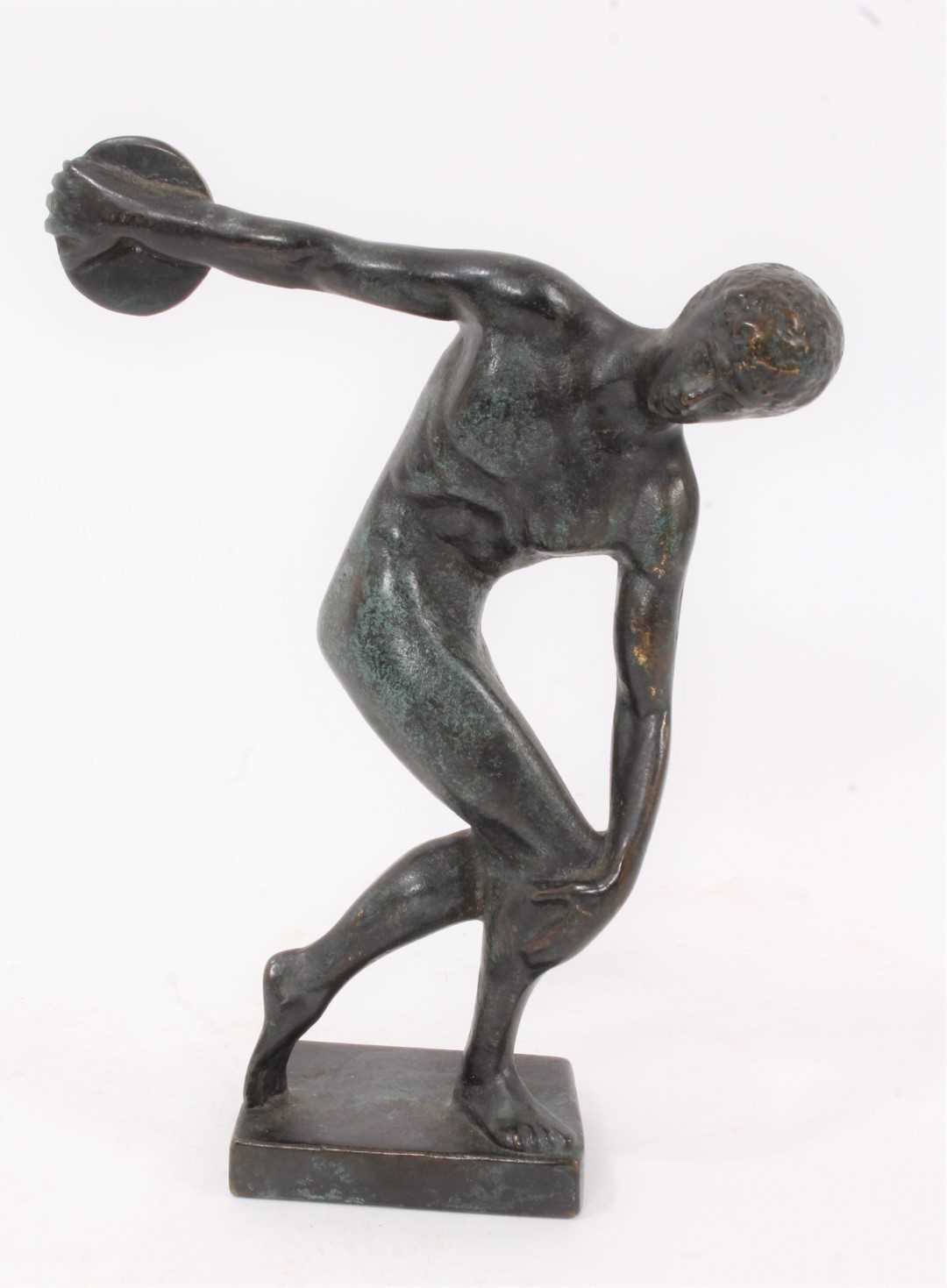 Lot 580 - After Myron - a patinated bronze model of discobolus