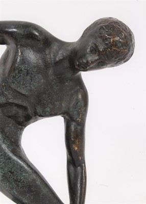 Lot 580 - After Myron - a patinated bronze model of discobolus