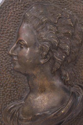 Lot 612 - Oval bronze relief portrait plaque of a lady