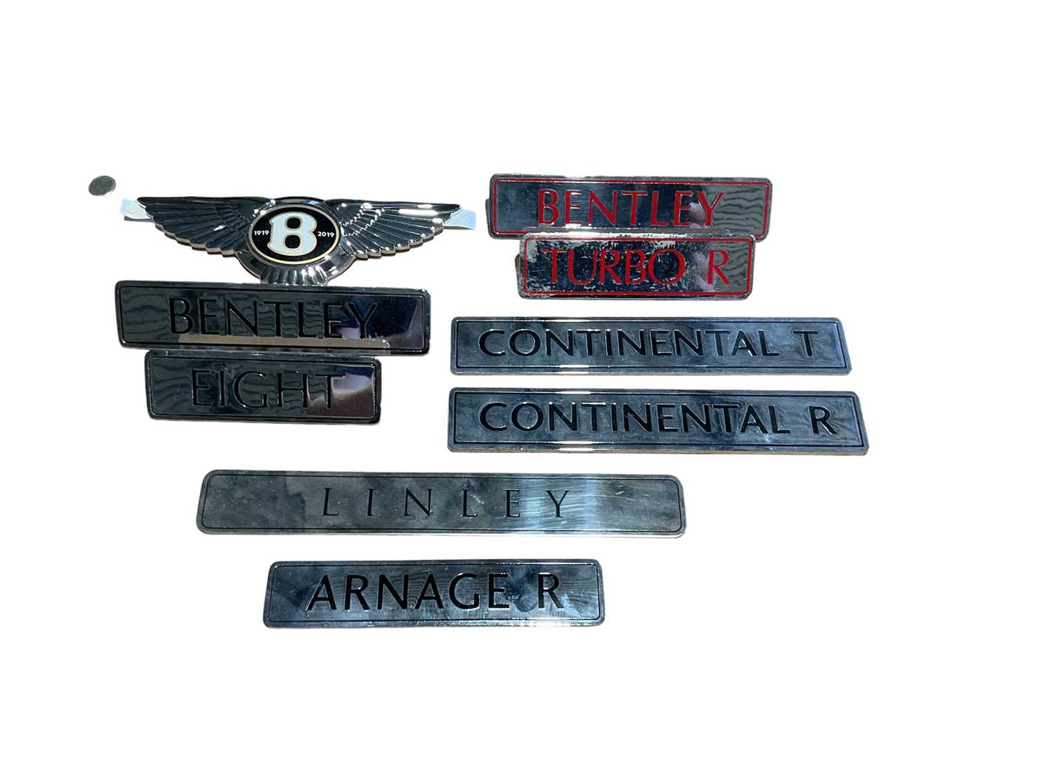 Lot 69 - Collection of Bentley enamelled model name plates and boot badges (9)