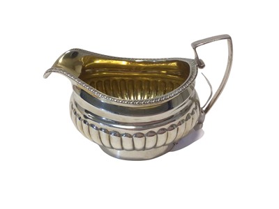 Lot 6 - George III silver fluted jug with gilt interior, London 1813 (Thomas Johnson), 12.5cm from spout to handle, 4.3oz